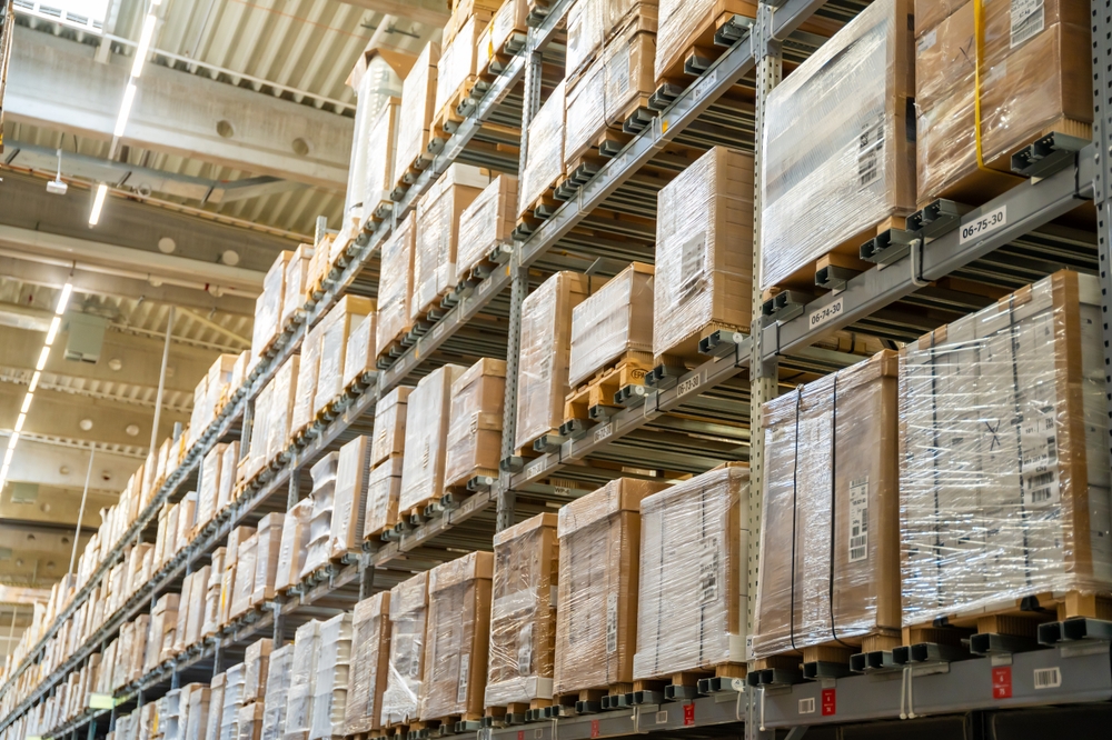 Long,Shelves,With,Many,Cardboard,Boxes,With,Product,In,Warehouse Long,Shelves,With,Many,Cardboard,Boxes,With,Product,In,Warehouse